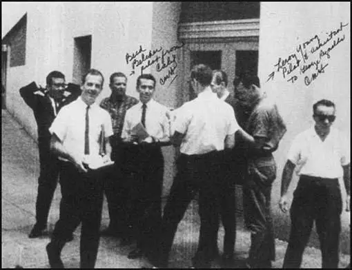 Lee Harvey Oswald handing out pamphlets in New Orleans. Holt is the man on the far right. Holt has written in the names of some of the people involved in this operation.