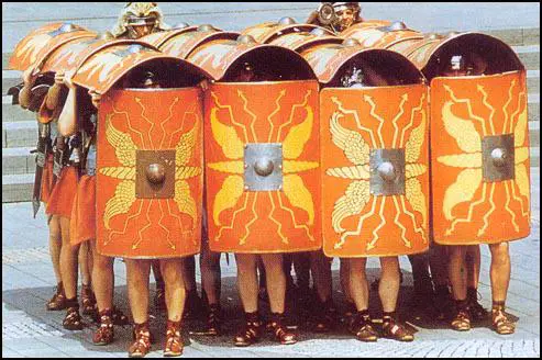 A modern reconstruction of Roman soldiers in the testudo (tortoise) formation.
