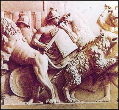 Sculptured relief of slaves fighting wild animals in the Roman Games.