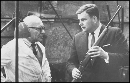 Samuel Cummings (right) inspecting weapons