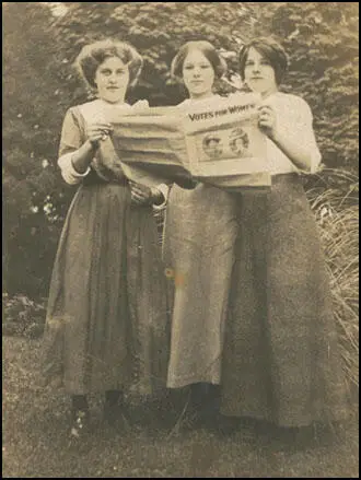 Three of Emily's daughters reading Votes for Women (January 1908)