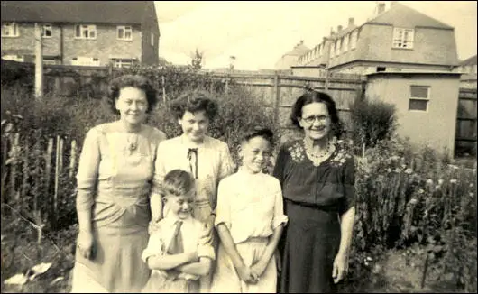 Mum (41), Tricia (13), David (6) John (10) and Elizabeth Hughes (62) in the back garden at 27 Audley Gardens (1955)