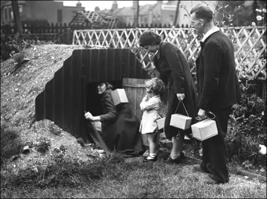 A family entering an Anderson Shelter