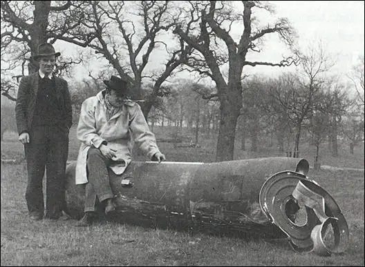 20th Duke of Suffolk with his customary cigarette holder and his assistant Fred Hands