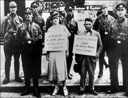 In 1933, Jewish businessman Oskar Danker and his girlfriend, a Christian woman, were forced to carry signs discouraging Jewish-German integration.