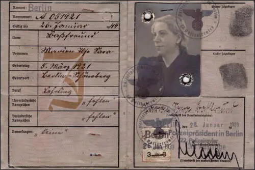 Identification card issued to Marion Basfreund and stamped with a red J for Jude and the added middle name of "Sara."