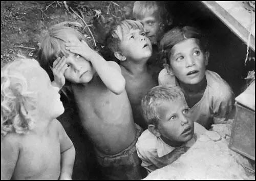 Russian children take shelter in a trench of Stalingrad due to Luftwaffe bombardment.