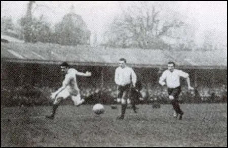 Billy Meredith races past two Bolton Wanderers defenders in the 1904 FA Cup Final.