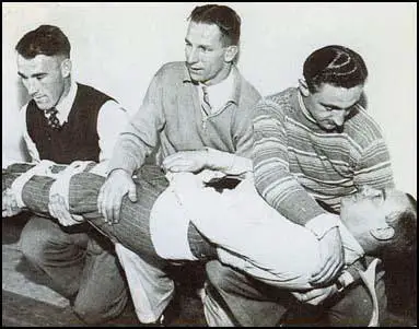 Emlyn Williams, Andrew Beattie and Lloyd Iceton practice first aid at the local Air Raid Precautions centre in November, 1939.