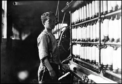 John Dempsey aged eleven working in a mule-spinningroom in Rhode Island in April 1909.