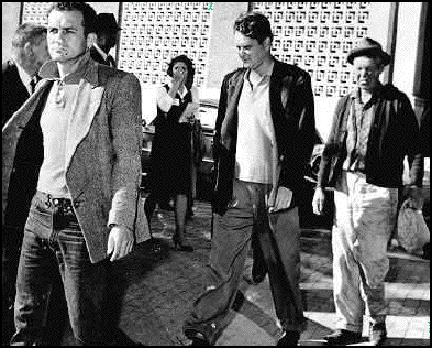 Photograph of the tramps arrested at the Dealey Plaza. It has been argued that Charles Rogers is on the left and Harrelson is in the middle of the photograph.
