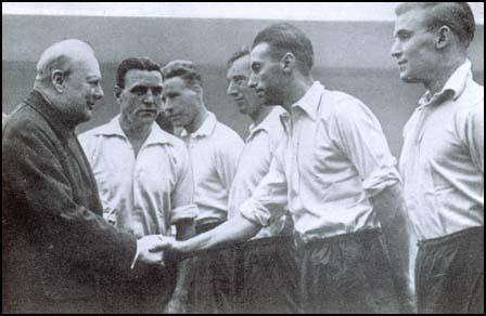 Stanley Matthews meets Winston Churchill in 1941. Also in the pictureis Eddie Hapgood and Wilf Mannion.