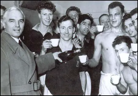 Raich Carter celebrates promotion with Leeds United in 1956.