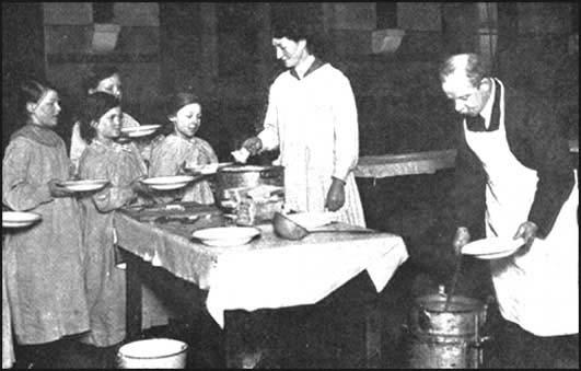 The headmaster of Green Lane School, Bradford, JonathanPriestley (father of J. B. Priestley), serving free school meals.