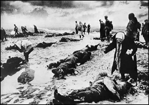 Kerch, like other parts of the Soviet Union suffered at the hands of the Schutz Staffeinel (SS).Dmitri Baltermants took this photograph of survivors seaching for friends and relatives in 1942.