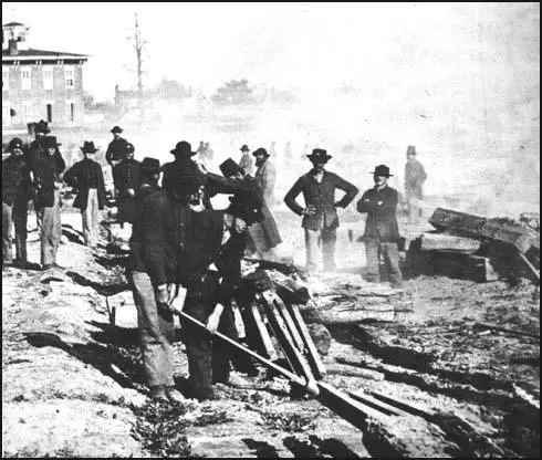 Photograph by George N. Barnard of Union Armytroops pulling up railroad tracks in Atlanta (1864)