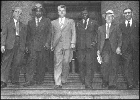 William Z. Foster, Benjamin Davis, Eugene Dennis,Henry Winston, John Williamson and Jacob Stachelleaving the courthouse in New York (21st July, 1948)