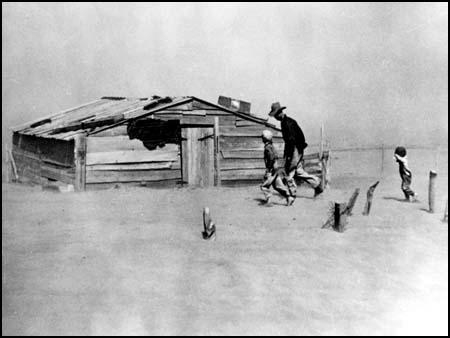 A farmer and his two sons during a dust storm in Cimarron County, Oklahoma (April 1936)