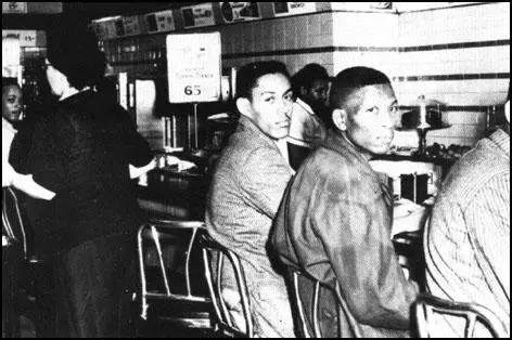 Students attempting to obtain service in Woolworths'white lunch-counter in Greensboro, North Carolina (1963)