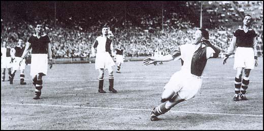 Dick Walker and Ted Fenton defending a Blackburn Rovers attack in the 1940 League Cup Final.