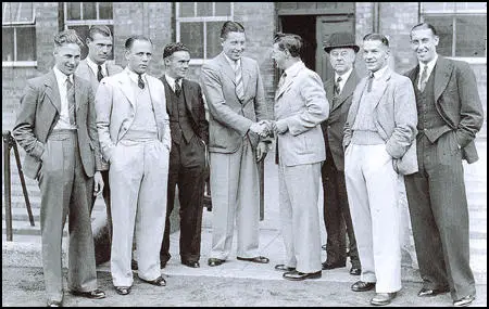 Alex Scott, centre, meets the rest of the team after his transfer in 1935.