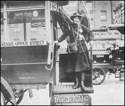 A woman conductor on a London bus.