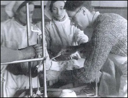 Thora Silverthorne with Dr Alex Tudor-Hart in a field operating theatre.